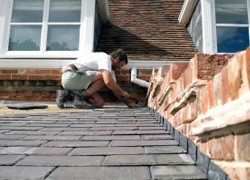 Working on a tiled roof in Sheffield
